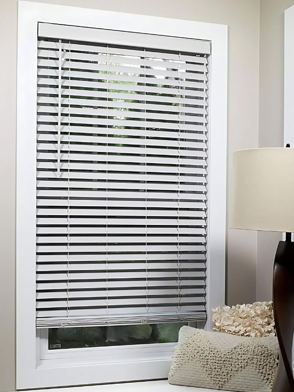 White faux wood blinds fitted to a Vancouver window
